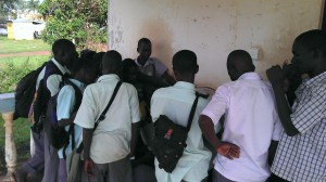 Gulu youth gather around a UNICEF Digital Drum